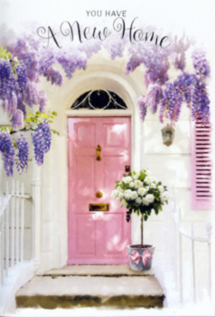 This image captures a sunlit entrance in Forest Gate that feels like a love letter to fresh starts and gentle celebrations. The front door is painted a soothing shade of pastel pink, its surface smooth and slightly glossy, reflecting a faint shimmer of daylight. To one side, a matching shutter echoes the same blush tone, tying the scene together against the whitewashed wall whose faint imperfections give the home a sense of character and history. Above and around the frame, wisteria drapes in lush, cascading strands of lavender and pale purple, each bloom forming a small, delicate cluster that hangs down like a veil. The flowers create a fragrant archway over the door, reminiscent of the blossoming trees you might spot wandering down quieter Forest Gate side streets toward Manor Park. Just at the doorstep, a chic metal bucket in soft grey serves as an understated vessel for a lavish bouquet. White and cream roses spill over its edge, their petals velvety, layered, and full, showing off that just-picked fullness that florists pride themselves on. Interspersed among the roses are soft green leaves and delicate foliage sprigs, adding contrast, life, and a hint of wildness. Around the base of the bucket, a pink ribbon-close in shade to the door but slightly more muted-has been tied into a simple bow, its tails lying easily across the stone step. The light is warm but gentle, casting dappled shadows from the wisteria across the doorway and flowers, creating a sense of peaceful anticipation. It feels like the perfect floral scene for a housewarming: a quiet yet heartfelt way to say, This is home now, crafted with the same care a local Forest Gate florist brings to every new-home delivery.